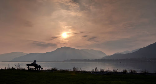 Scenic view of lake against sky during sunset