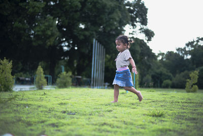 Full length of woman standing on field