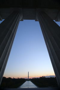 Low angle view of bridge against clear blue sky