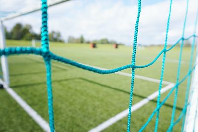 Close-up of soccer field against sky