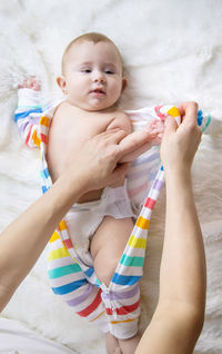 Midsection of woman holding baby