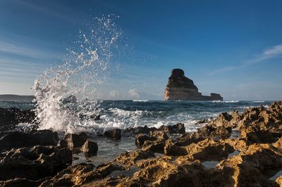 Waves splashing on beach at night