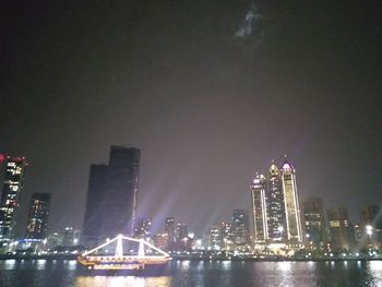 Illuminated city buildings at night