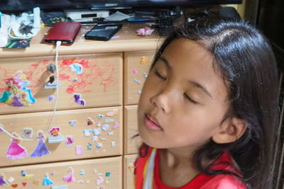 Portrait of girl looking at home