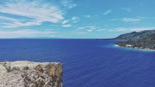 Scenic view of sea against blue sky