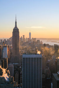 View of cityscape against sky during sunset