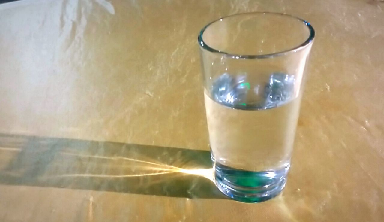 CLOSE-UP OF DRINK IN GLASS