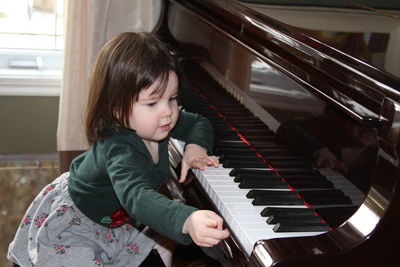 Young woman playing piano