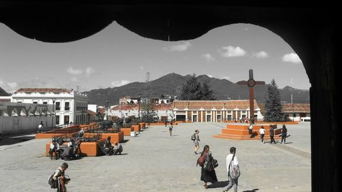 View of people on mountain against sky