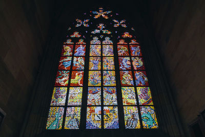 Low angle view of stained glass window of building