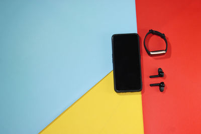 Close-up of telephone booth against wall