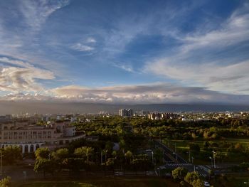 High angle view of trees and buildings against sky