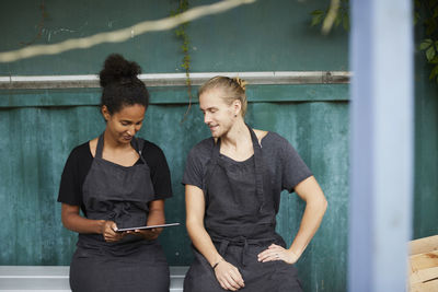 Portrait of boys standing on mobile phone