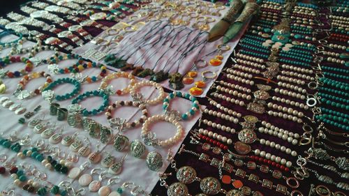 High angle view of various jewelry for sale in store
