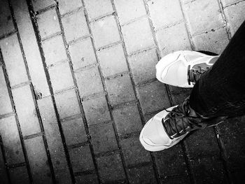 Low section of man standing on floor