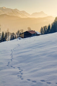 Scenic view of snowcapped mountain against sky during winter