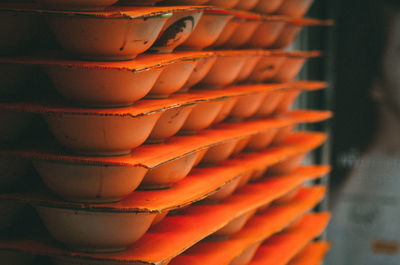 Close-up of orange stacked bowls