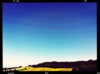 Scenic view of landscape against clear blue sky