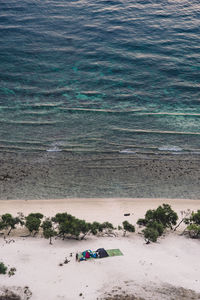 High angle view of sea with sandy beach