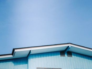 Low angle view of building against blue sky