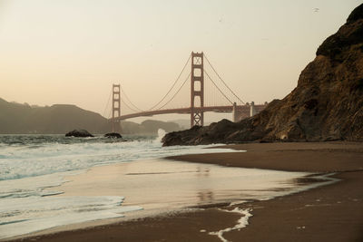 View of suspension bridge at sunset