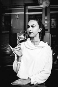 Young woman drinking beer glass