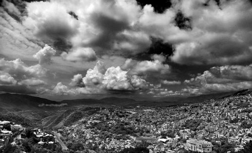 Cloudy sky over mountain range