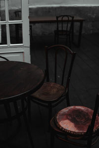 High angle view of empty chairs and table in building