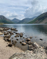 Scenic view of lake and mountains against sky