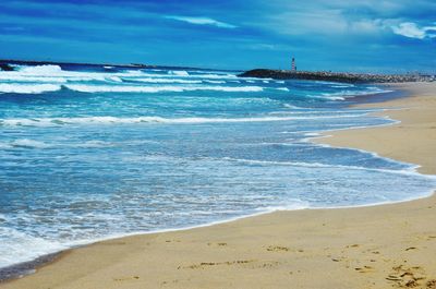 Scenic view of beach against sky