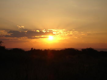 Scenic view of silhouette landscape against sky during sunset