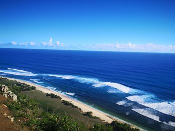 Scenic view of sea against blue sky