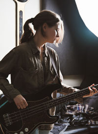 Young woman playing guitar