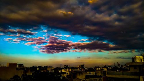 Panoramic view of cityscape against sky during sunset