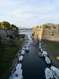 High angle view of river amidst buildings against sky