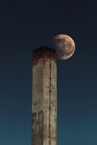 Low angle view of tower against sky at night