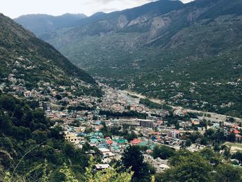 High angle view of townscape and mountains