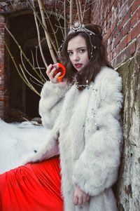 Portrait of beautiful young woman in snow