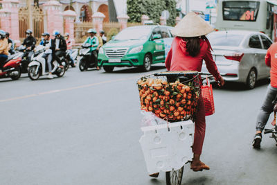 People walking on road in city