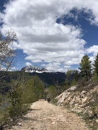 Scenic view of landscape against cloudy sky