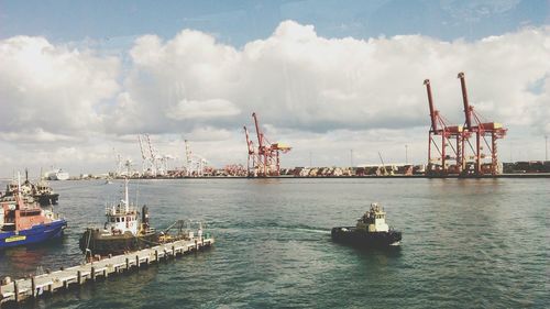 Boats moored at harbor