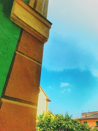 Low angle view of built structure against blue sky