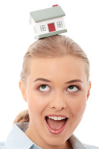 Portrait of a smiling young woman over white background