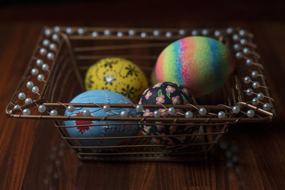Close-up of easter eggs basket on table