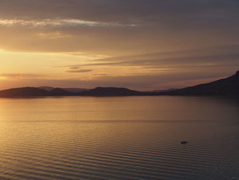 Scenic view of lake during sunset