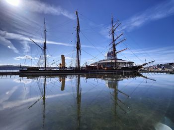 Sailboats on sea against sky