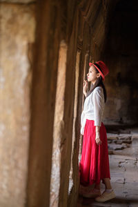 Full length of cute baby girl in temple