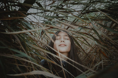 Portrait of woman with plants