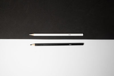 High angle view of pen on table against black background