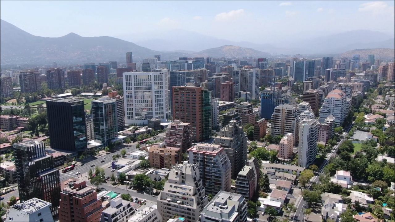 HIGH ANGLE VIEW OF BUILDINGS AGAINST SKY IN CITY